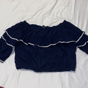 blue crop top with ruffles and white striped detail